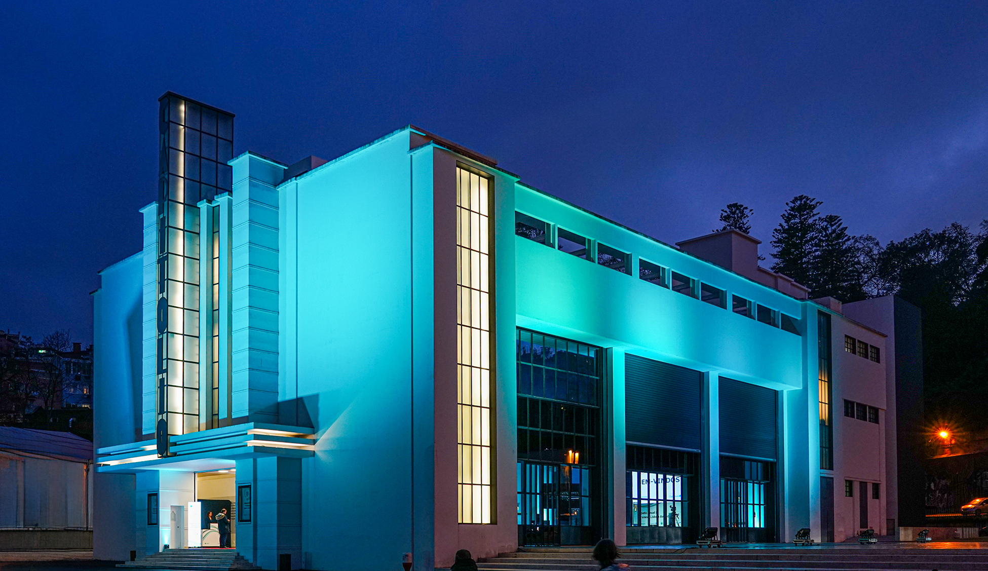 Facade and side of the building, at night