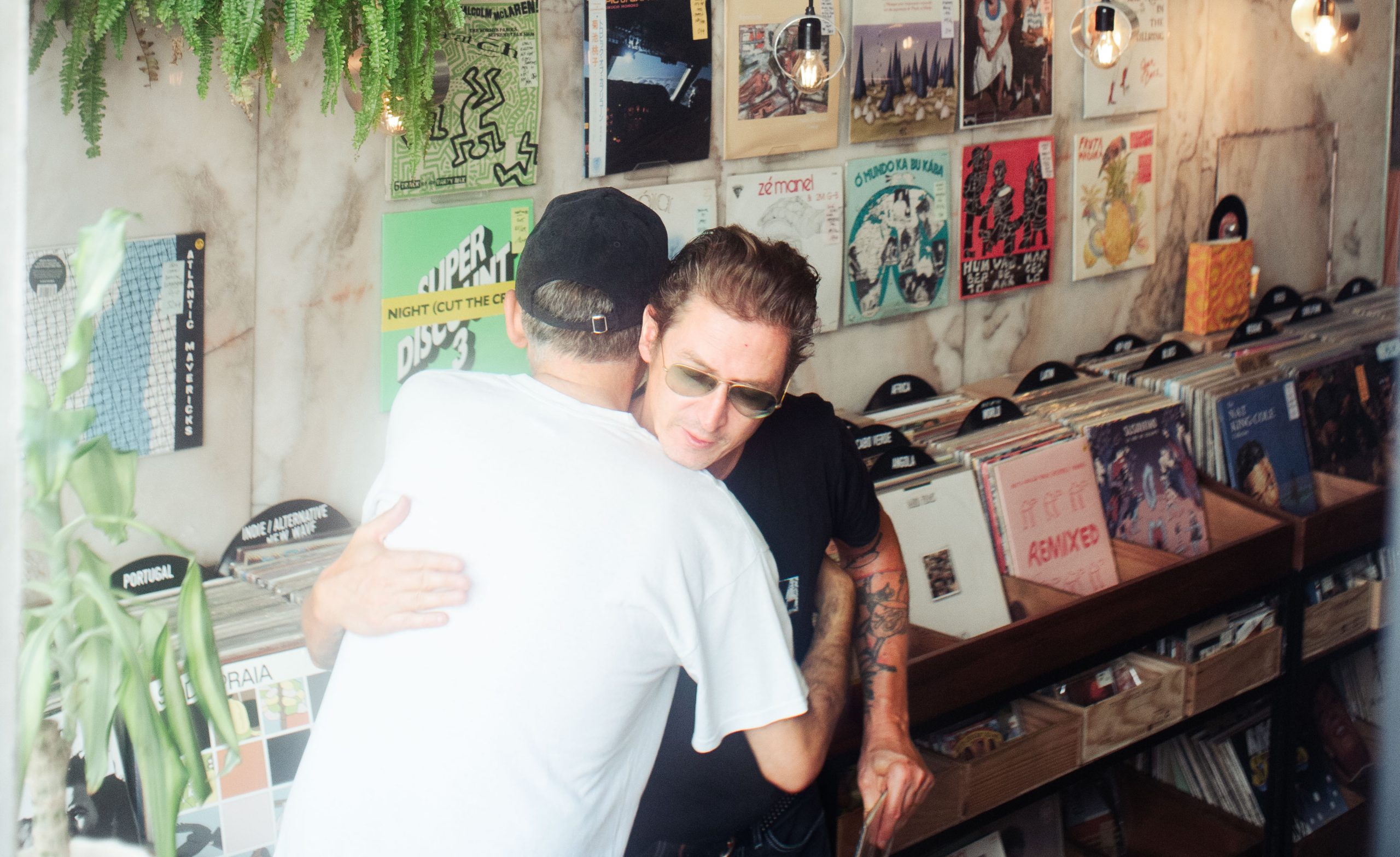 2 men greet each other with a hug